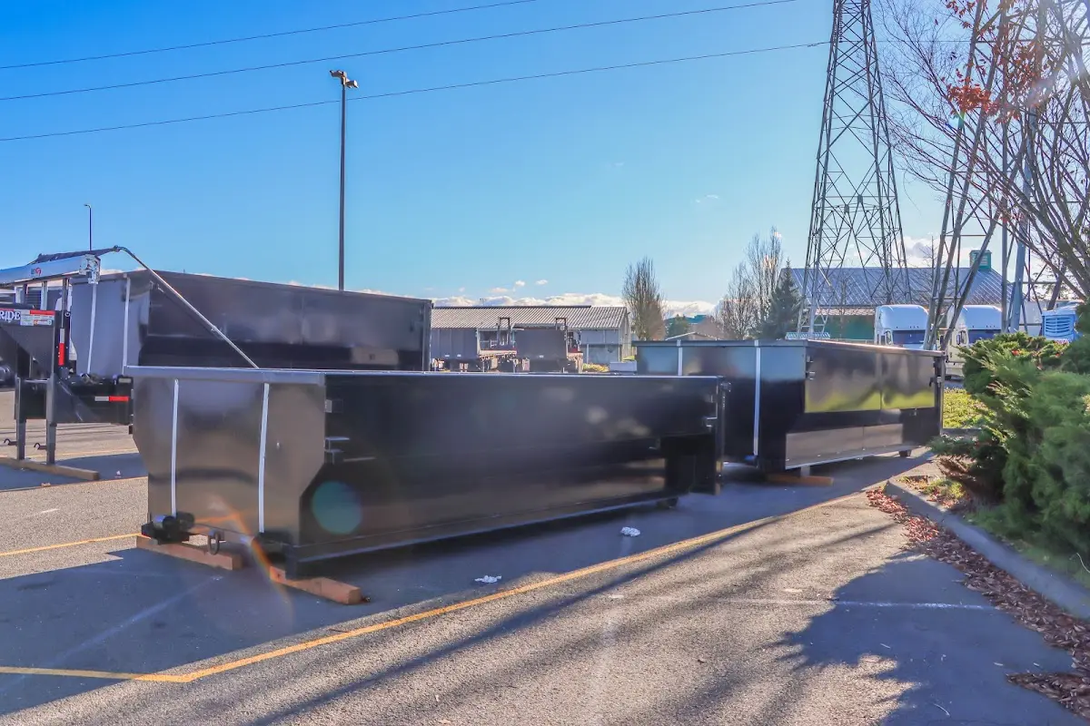 Roll-off dumpster ready for waste disposal at job site for Demolition Dumpster Rental in Flowood